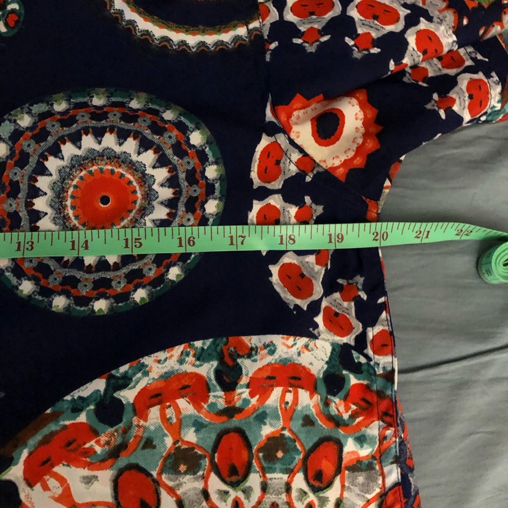 Raga Man short sleeved men’s shirt. 20” across, 28” long